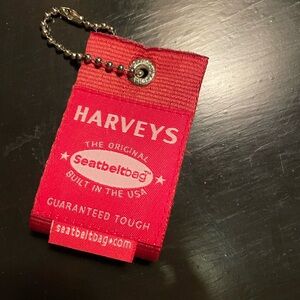 Harvey’s hang tag. Red, large.